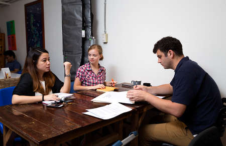 Manila, Philippines - August, 10, 2016: A group of people discuss  ideas in a cafe,  casual business meetingのeditorial素材