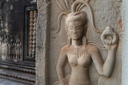 Siem Reap, Cambodia - January 30, 2017: Bas-relief mural of the woman Apsara on wall Angkor Wat...