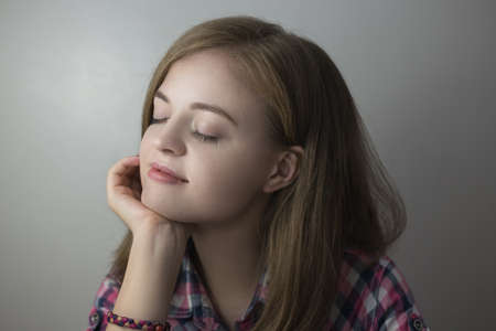 Portrait of smiling pretty caucasian woman girlの写真素材