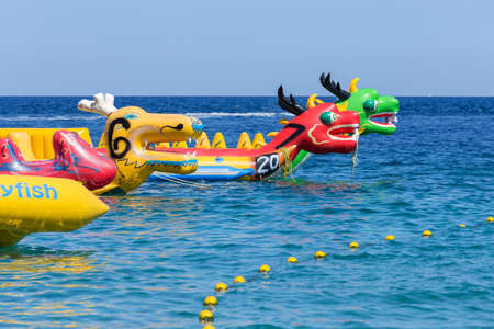 Puerto Galera, Sabang, Philippines - April 4, 2017:  Inflatable attractions, banana dragon boats near White beachのeditorial素材