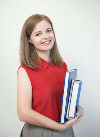 Young caucasian girl woman with many books study at school or university, or teacher