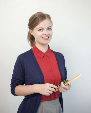 Young caucasian girl woman taking notes in notebook clipboard