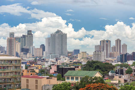 Manila, Philippines - June 7, 2017: Cityscape of Manila: slums ghetto and skyscrapers