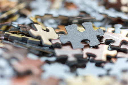 Mixed jigsaw puzzle pieces background, macro close upの写真素材