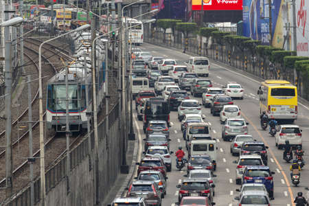 Manila, Philippines - January, 20, 2020: Heavy traffic, many cars and MRT train on Edsa road in rush hourのeditorial素材