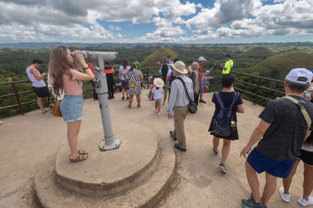 Bohol, Philippines - January, 27, 2020: Many people tourists visit Chocolate Hillsの写真素材