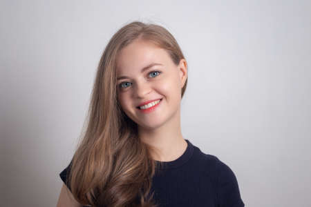 Smiling young caucasian girl woman, looking happy and positive