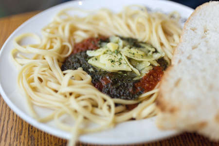 Authentic Italian spaghetti pasta Bolognese with tomato cheese sauce in a restaurant, close up, macroの写真素材