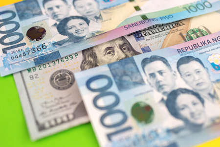 Close up of cash banknote of one thousand Philippines peso and us dollar, macroの写真素材