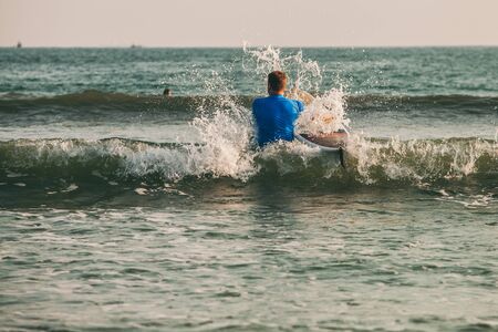 surfer siting on the board