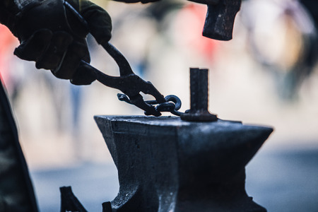Blacksmith crafting a metal item