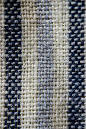 White and blue stitches wool textile pattern macro, clothing