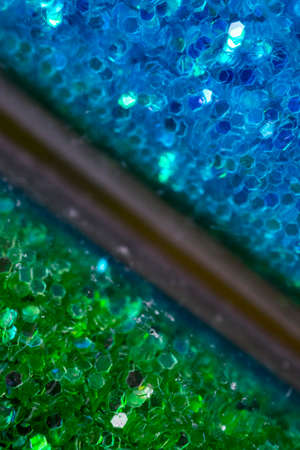 Green and blue glitter on glass tubes, macroの写真素材