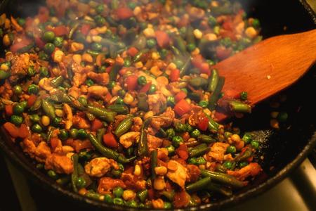 Fried vegetables in a frying pan, yummy foodの写真素材