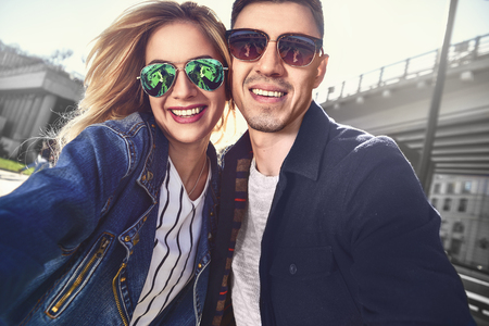 Pretty tourists make funny photos for travel blog in Europe.の写真素材