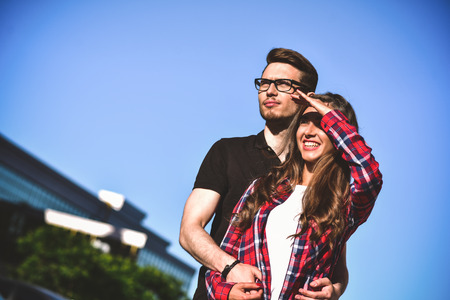 Awesome couple walking at street enjoying a summer and each other.の写真素材