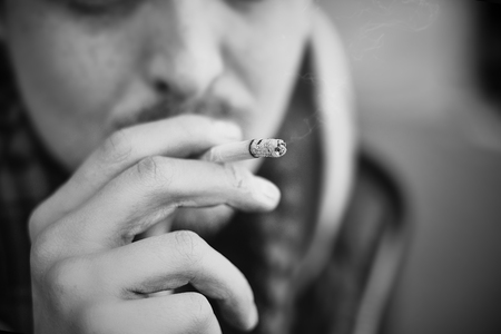 Man smoking cigarette Close up of an smoking cigaretteの写真素材
