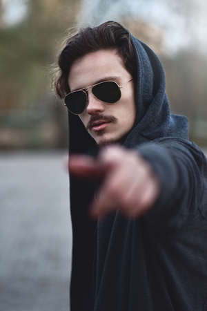 Handsome young curly man' pose says: " You! You! Yes, you are!"の写真素材