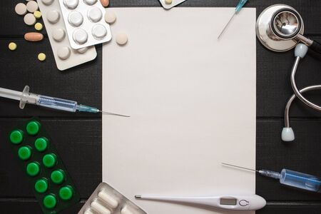 Medication prescription with pills and stethoscope lies on wooden table. Tablet or drug. Medicine...