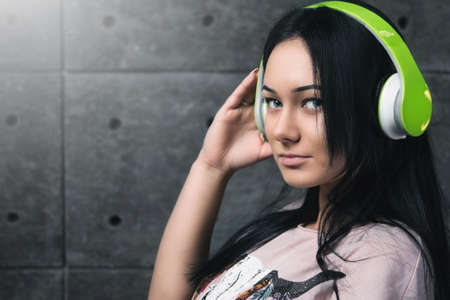 Sexy brunette with the headphones.の写真素材