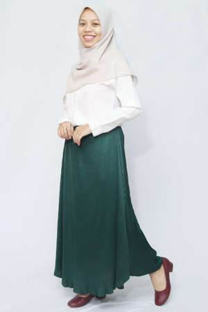 portrait of asian woman wearing white shirt and color skirt. woman in casual dress on white background isolated. profile photo for clothing store designの写真素材