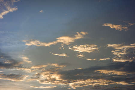 clear blue sky in the afternoon. bright orange clouds at sunset