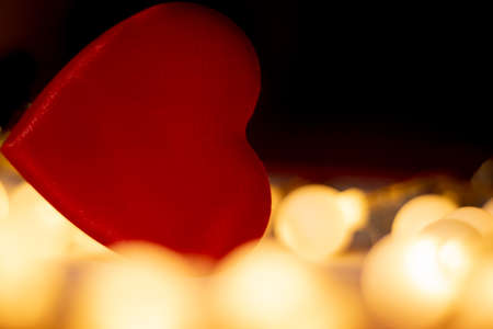 red valentine heart, yellow unfocussed lightsの写真素材