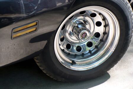car wheel rim silver metallic steel black decorative automobileの写真素材