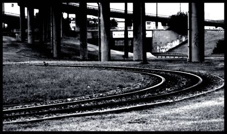 tram tracks loop bend black and white viaduct construction polesの写真素材
