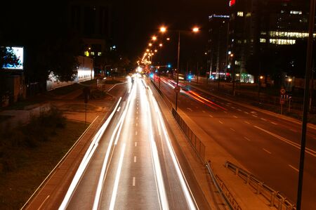 city lights long exposure street life in the city speed highway white and red lights environment cars speedの写真素材