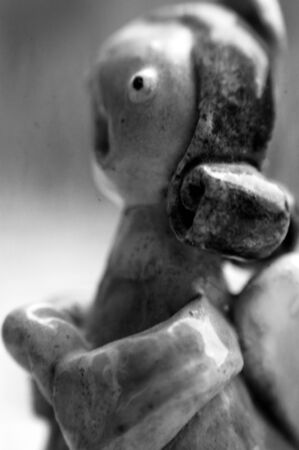 clay figurine in the shape of an angel praying and singingの写真素材
