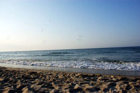 soap bubbles in the wind on the seashore on the seaの写真素材