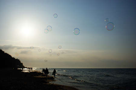 soap bubbles in the wind on the seashore on the sea