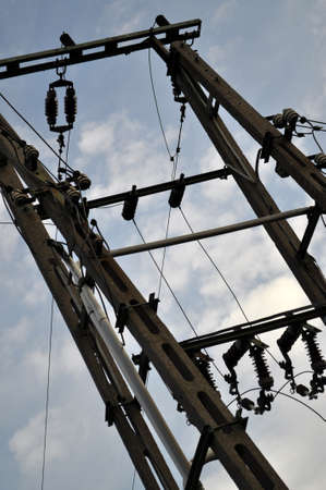 high voltage pole in the city on a background of the danger sky bottom shotの写真素材