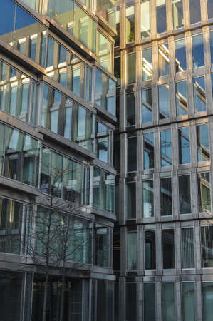 glass office building blue architecture office district mirrored reflection