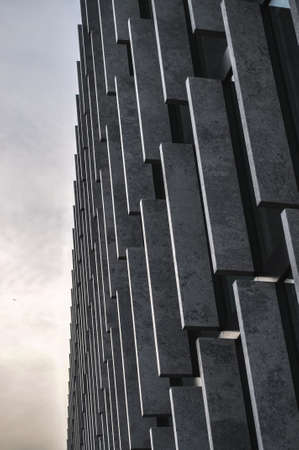 glass wall facade of skyscraper building on a blue sky