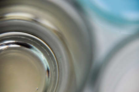 three glasses with colorful drinks blue white yellow closeupの写真素材