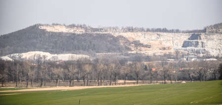 green meadow field in the countryside beautiful view calm quarry in the backgroundの写真素材