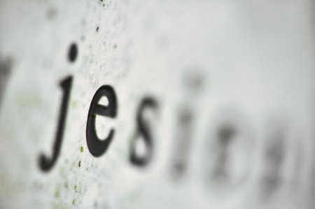 a close-up of text, specifically the letters, with blurred, highlighting the effects of selective...