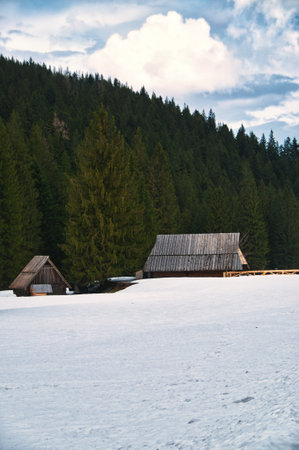 Wooden cottage in the mountains, winter landscape covered with snow Tatra Polandの写真素材