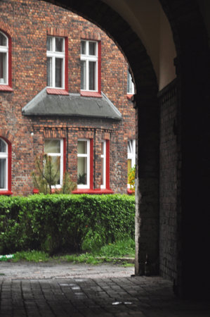 A brick gate of a building, a passage between buildings old townの写真素材
