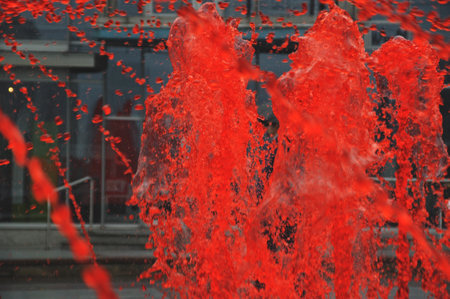 Fountain with red colored water in Katowice cityの写真素材