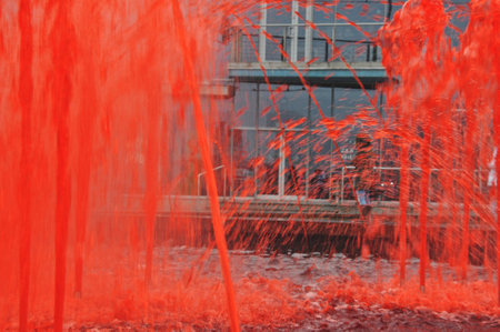 Fountain with red colored water in Katowice cityの写真素材