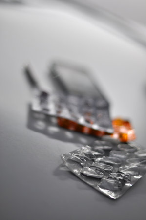 Tablets in blister packs, partially emptied, lyingの写真素材