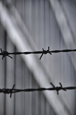concrete gray windows in old fabric building architecture rusty fence with spikes