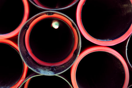 closeup of red plastic pipes with their insidesの写真素材