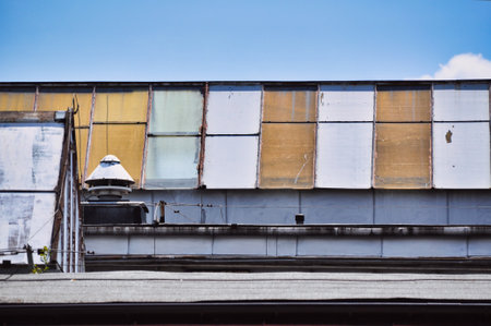 factory glass conical roof damaged painted windowsの写真素材