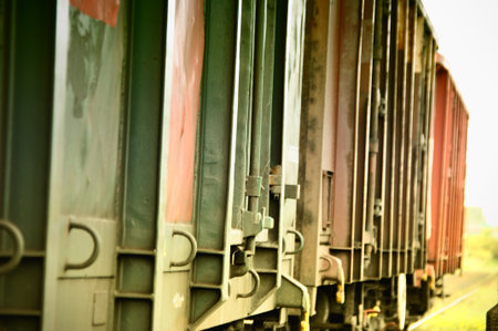 Colorful freight train wagons, close-up of metal wagons on a sidingの写真素材
