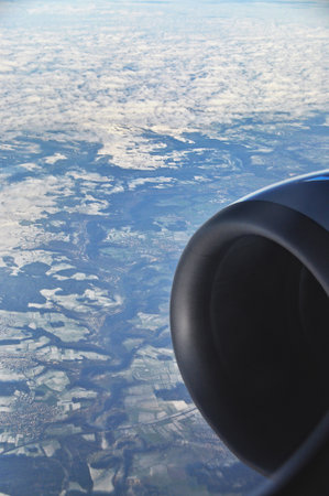Europe landscape seen from airplane window above clouds