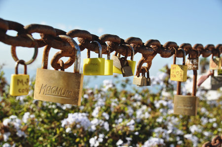 Colorful love locks on rusty chain in Lanzaroteの写真素材